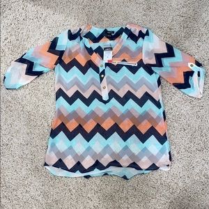 Selling a colorful blouse.